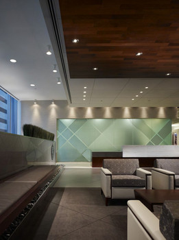 Office waiting area with seats and custom lighting