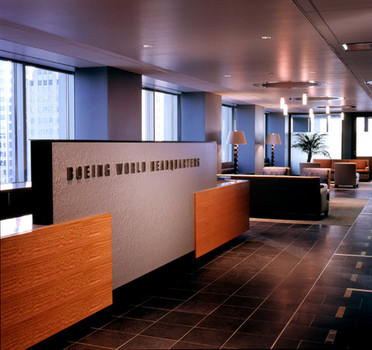 Custom woodwork and reception desk in office building. Large sign reads Boeing World Headquarters.